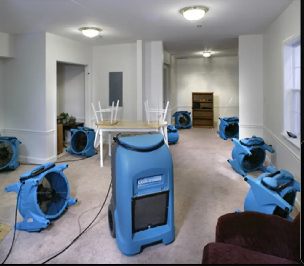 Air movers and dehumidifier setup for Water Damage Restoration in Krum